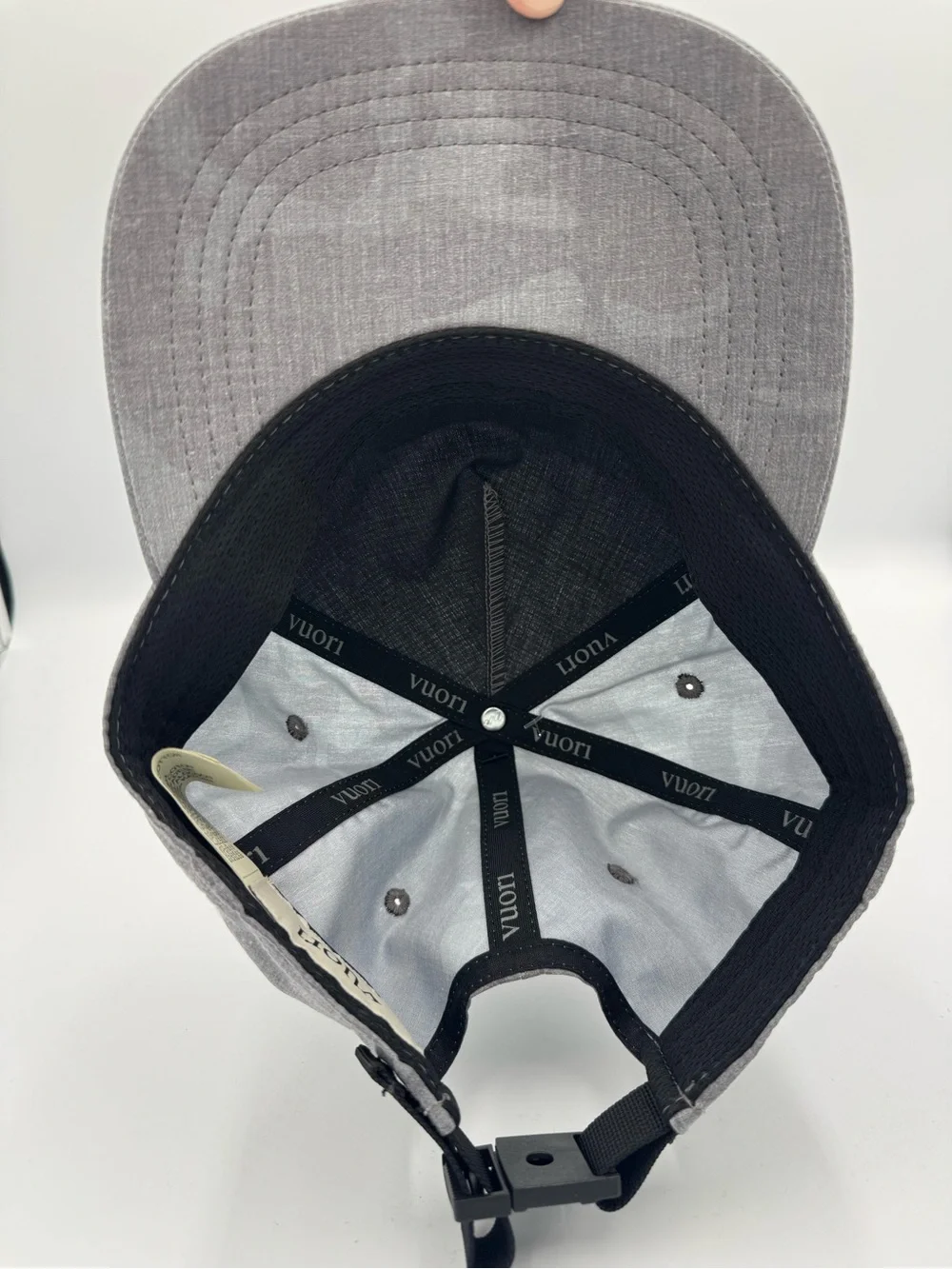 Vuori Gray Five-Panel Adjustable Cap/ Front Patch with faint camo design on brim